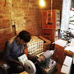Bone made items are being polished by artisan. 